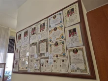 Signs hanging in the office of papal charities in Vatican City show the different models of papal blessing certificates that can be ordered, Tuesday, July 29, 2025.
