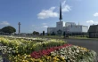 Flowers stand before Knock Shrine in Knock, Ireland, Friday, Aug. 15, 2025