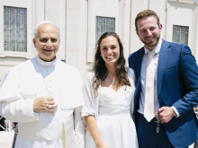 Newlyweds Anna and Cole Stevens meet Pope Leo XIV at the general audience in Rome on Wednesday, June 11, 2025.