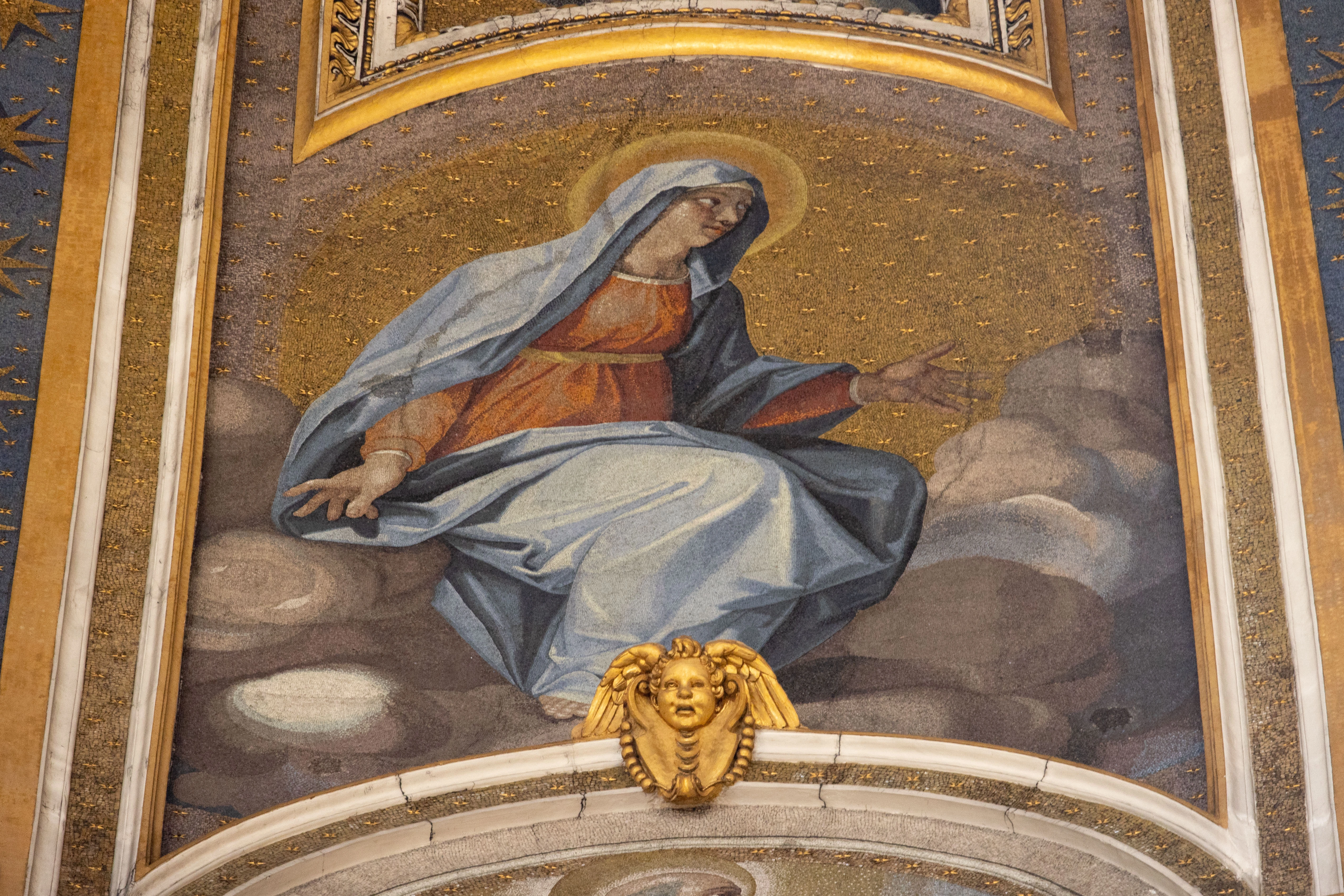 The mosaics decorating the interior dome of St. Peter’s Basilica depict the Blessed Virgin Mary next to Christ the Redeemer and the Apostles.?w=200&h=150