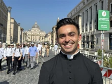 Seminarian Thomas Hammen smiles in view of St. Peter’s Basilica in Rome on Tuesday. June 24, 2025.