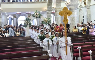 Children process into the St. Mary al-Tahir Church, also known as the Church of the Immaculate Conception, in Baghdad, for their first Communion. Credit: Chaldean Catholic Church