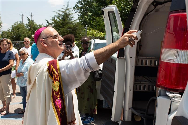 Auxiliary Bishop Mark Rivituso of St. Louis blesses donations in a van used during the National Eucharistic Pilgrimage in July 2024. On July 1, 2025, Pope Leo XIV appointed Rivituso archbishop of Mobile, Alabama.?w=200&h=150