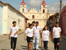 Young people walk the streets of Camagüey, Cuba.