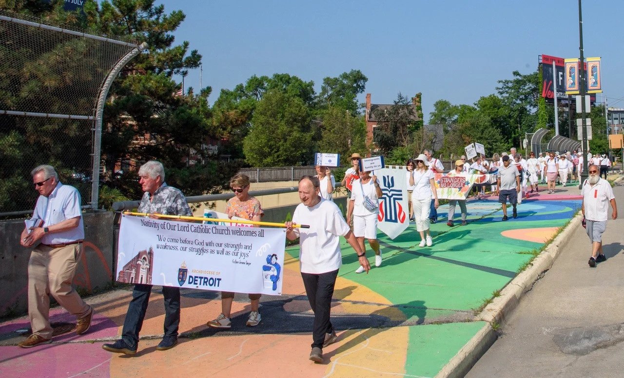 Members of the Catholic nonprofit Strangers No Longer and others march to the Detroit ICE headquarters in July 2025.?w=200&h=150