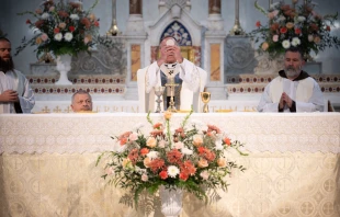 Archbishop Charles C. Thompson elevates the Eucharist during the Opening Mass at St. John the Evangelist Church in Indianapolis, marking the official launch of the St. Katharine Drexel Route. May 18, 2025. Credit: Jeffrey Bruno