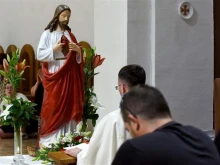 Faithful pray before a statue of the Sacred Heart of Jesus during Croatia’s consecration ceremony on June 27, 2025, as the nation dedicated itself anew to Christ’s divine love following the tradition established by their ancestors at the Church of Our Miraculous Lady of Sinj.