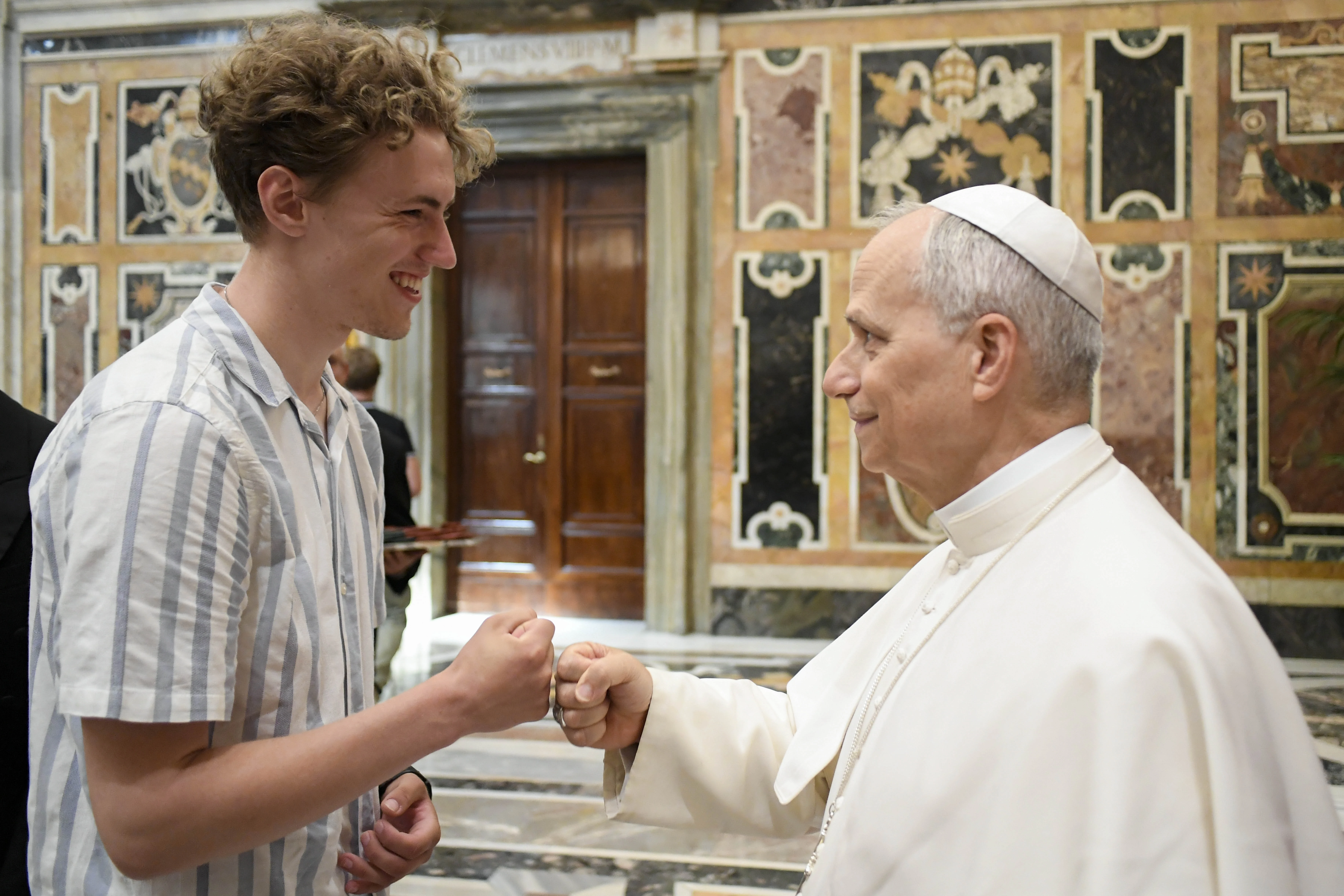 Pope Leo XIV greets a young pilgrim in Rome during a meeting with group of teachers and young people from Denmark, England, Ireland, Scotland, and Wales, Saturday, July 5, 2025.?w=200&h=150