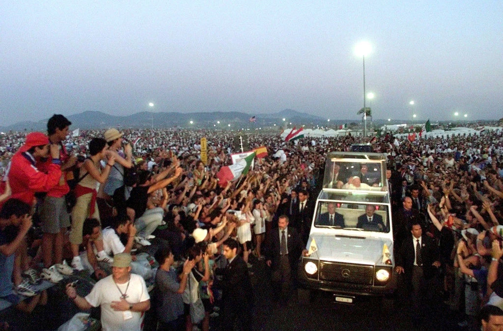 Pope John Paul II blesses young faithful as he arrives at Tor Vergata campus to take part in World Youth Day on Aug. 19, 2000. More than 2 million young people turned out under a blazing sun to see the pope.?w=200&h=150