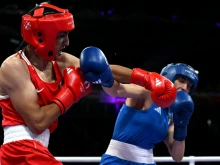 Algeria’s Imane Khelif (in red) punches Italy’s Angela Carini in the women’s 66kg preliminaries round of 16 boxing match during the Paris 2024 Olympic Games at the North Paris Arena in Villepinte on Aug. 1, 2024.