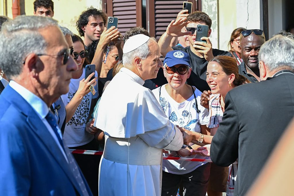 Pope Leo XIV greets people as he arrives for a two-week stay in the summer papal estate in Castel Gandolfo, 25 miles southeast of Rome, on July 6, 2025. The newly elected pope revives a long-standing papal tradition paused under Francis, as Castel Gandolfo prepares to welcome a pope for the first time in over a decade.?w=200&h=150
