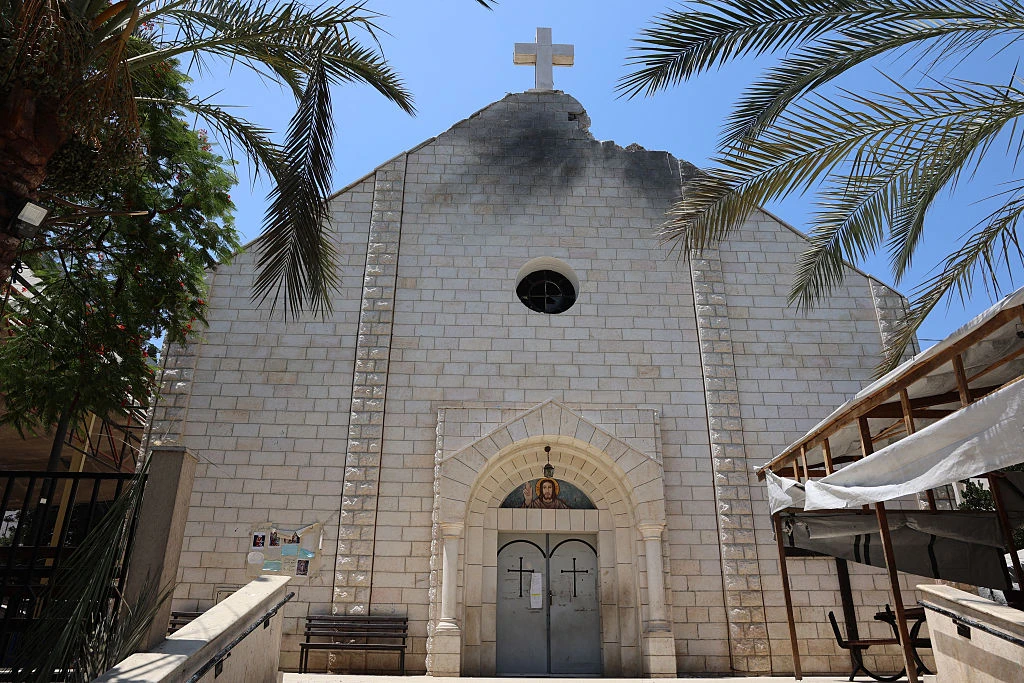 A picture shows a view of a damaged facade of the Holy Family Church on July 18, 2025, a day after it was hit in an Israeli strike in Gaza City on July 17.?w=200&h=150