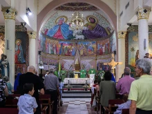 Worshippers attend a Sunday morning Mass led by Cardinal Pierbattista Pizzaballa, Latin patriarch of Jerusalem, at the Roman Catholic Church of the Holy Family in Gaza City on July 20, 2025.