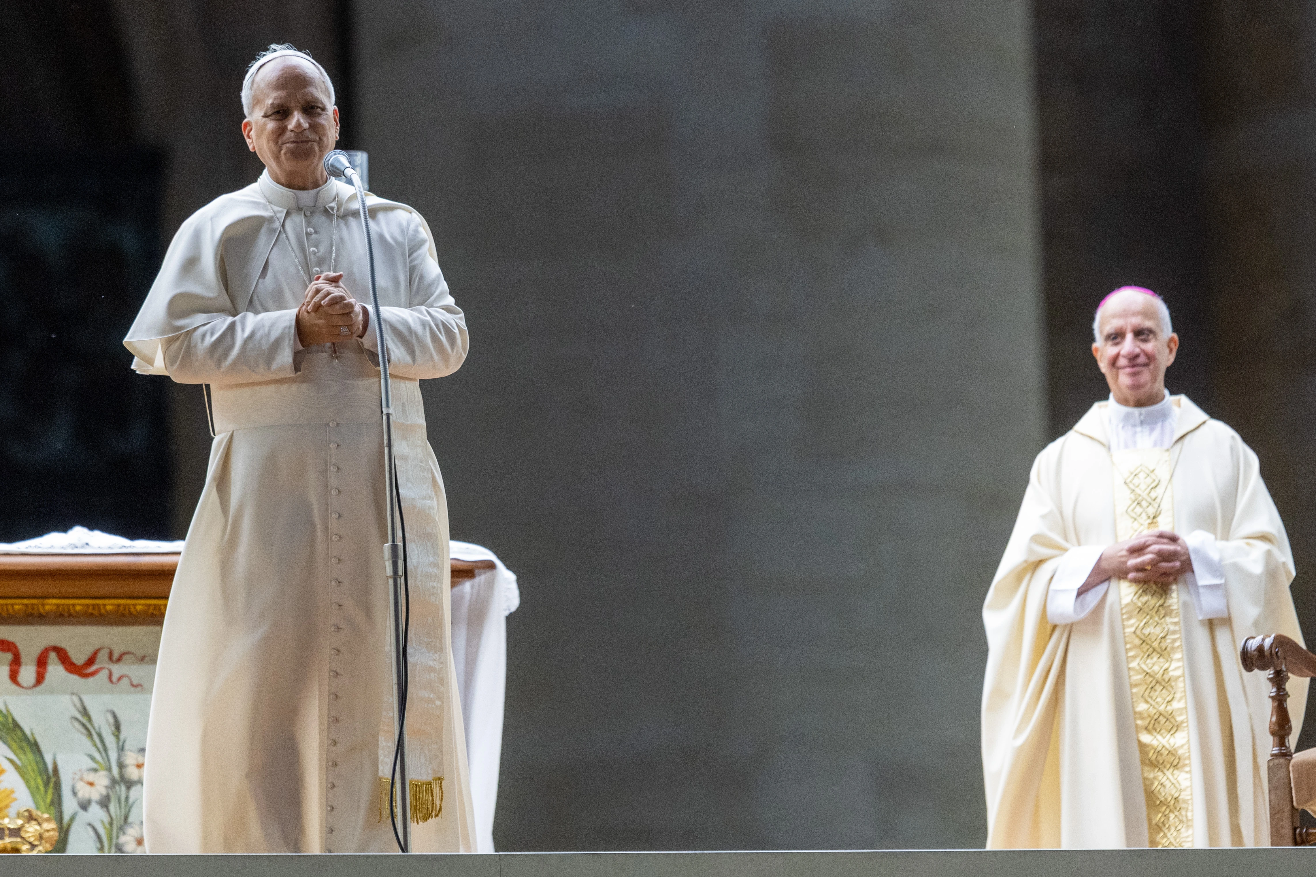 Pope Leo XIV addresses the crowd following his unexpected ride around St. Peter’s Square at the Vatican following the Jubilee of Youth welcome Mass — which was celebrated by Archbishop Rino Fisichella (right) — on July 29, 2025.?w=200&h=150
