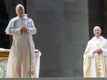 Pope Leo XIV addresses the crowd following his unexpected ride around St. Peter’s Square at the Vatican following the Jubilee of Youth welcome Mass — which was celebrated by Archbishop Rino Fisichella (right) — on July 29, 2025.