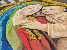 The Via della Conciliazione, the grand avenue leading to St. Peter’s Square in Rome, was transformed on Sunday, June 29, 2025, into a vibrant tapestry of color laid over the asphalt.