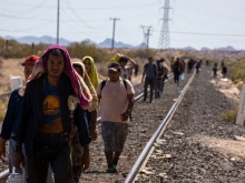 Migrants walk alongside the railroad tracks after dismounting from the “La Bestia” train, which they rode through Mexico to reach the Mexico-U.S. border near Chihuahua, Mexico, on Sept. 27, 2023.