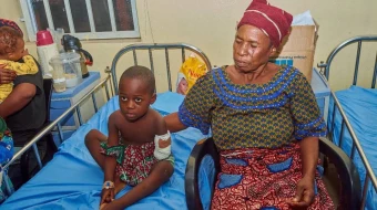 A child who lost his left hand in the June 2025 Yelewata massacre is treated at Nigeria’s Benue State University Teaching Hospital.