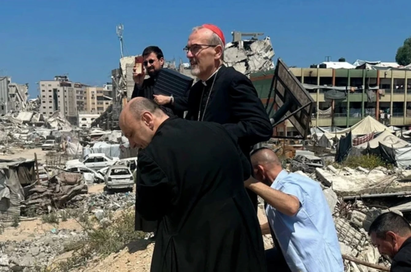 Cardinal Pierbattista Pizzaballa tours the war-torn area surrounding Holy Family Church with the parish’s pastor in Gaza, Father Gabriel Romanelli.?w=200&h=150