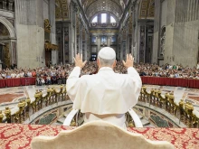 Pope Leo XIV blesses the crowd at his Wednesday general audience in St. Peter’s Basilica on Aug. 13, 2025, at the Vatican. Due to the heat, the pope gave his address in Paul VI Audience Hall but also greeted pilgrims in other locations.
