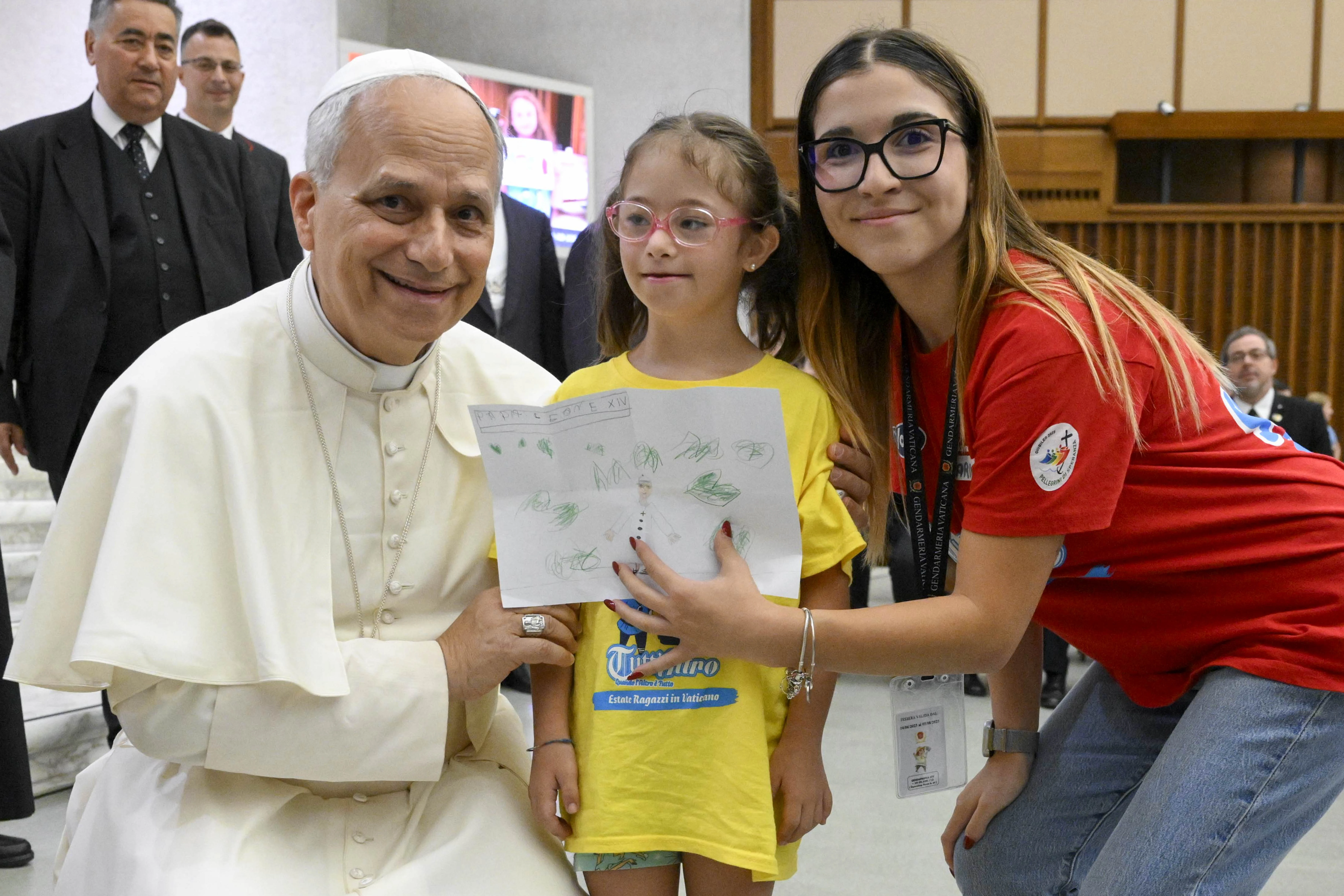 Pope Leo XIV receives a drawing from a girl participating in the “Estate Ragazzi in Vatican” summer camp on July 3, 2025, at the Vatican.?w=200&h=150