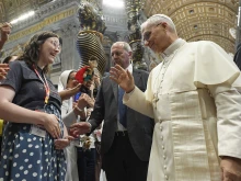 Pope Leo XIV blesses Elizabeth Busby and her baby on the way at the Mass for Digital Missionaries on July 29, 2025, at St. Peter’s Basilica at the Vatican. A family and marriage therapist, Busby hosts the “Discerning Marriage” podcast and developed the Next Step formation program for people who are discerning marriage.