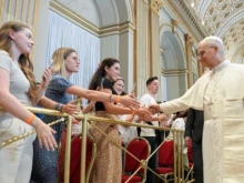 Pope Leo XIV greets a group of catechumens from France during an audience on July 29, 2025, at the Vatican.