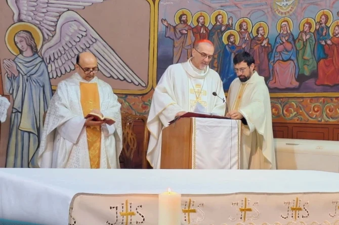 Father Gabriel Romanelli with Cardinal Pierbattista Pizzaballa, Latin patriarch of Jerusalem, celebrating Christmas Mass at Holy Family Parish in Gaza in December 2024.?w=200&h=150