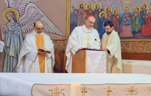 Father Gabriel Romanelli with Cardinal Pierbattista Pizzaballa, Latin patriarch of Jerusalem, celebrating Christmas Mass at Holy Family Parish in Gaza in December 2024. Credit: Courtesy of the Latin Patriarchate of Jerusalem