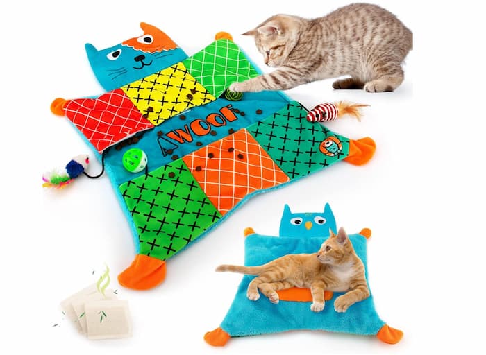 catnip toy with cats playing on mat