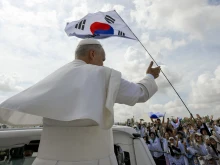 Pope Leo XIV waves at pilgrims from South Korea before the closing Mass of the Jubilee of Youth at the University of Rome Tor Vergata on Aug. 3, 2025.