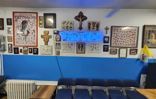 Catholic images and crucifixes fill the walls in Times Square Tattoo. Credit: Photo courtesy of Tommy Houlihan