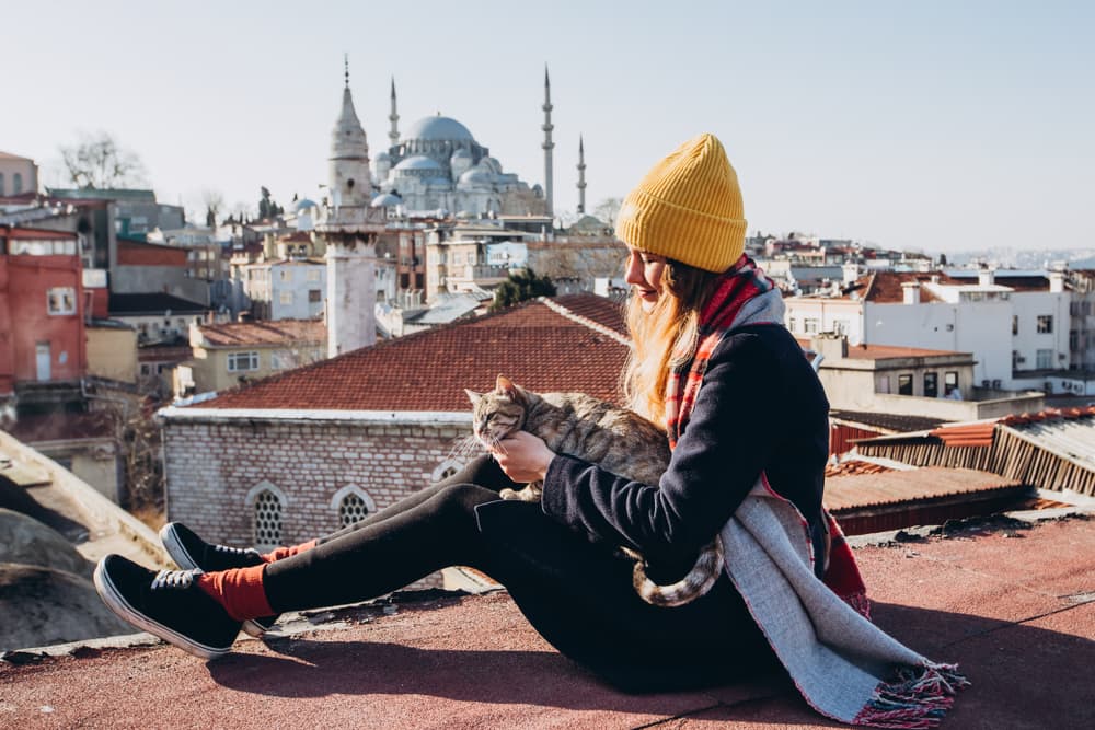 Girl traveling with her cat