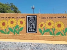 A wall with the image of “The Virgin Everywhere.”