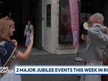A jubilee attendee snaps a shot of a fellow jubilee-goer in Rome during a broadcast of “EWTN News Nightly,” Monday, July 28, 2025.