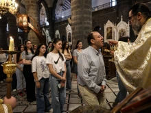 The faithful take part in the Divine Liturgy at Our Lady of the Olive Church in Damascus, Syria, on Sunday, June 29, 2025.